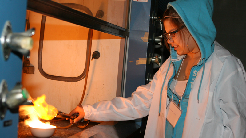 Shaylayna Staats makes fireworks in a Brock lab as part of the new Bridging Our Worlds Through Science program.