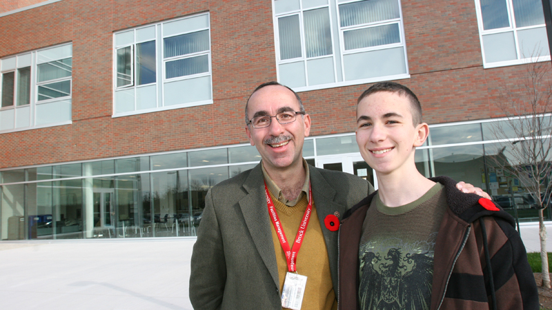 Tom Saint-Ivany and his son Matthew check out the new International Centre.