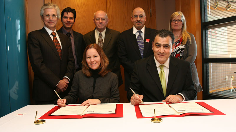 Attending the formal signing, from left: Thomas Dunk, Dean of Social Sciences; Dale Bradley, chair of Communication, Popular Culture and Film; Kim Meade, Vice-Provost and Associate Vice-President, Student Services; Huntly Duff, educational liaison for Canadian University in Dubai; Hichem Ben-El-Mechaiekh, Associate Dean of Mathematics and Science; Karim Chelli, President of Canadian Univesrity; Sheila Young, associate director of Brock International.