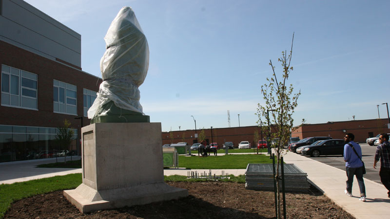 A statue of Confucius sits covered in advance of Sunday's grand opening of Brock's Confucius Institute.