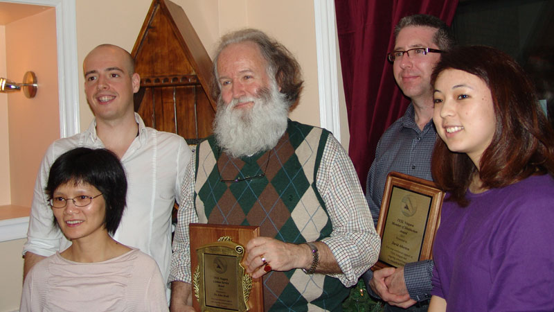 John Sivell, third from left, gets an award from TESL Niagara.