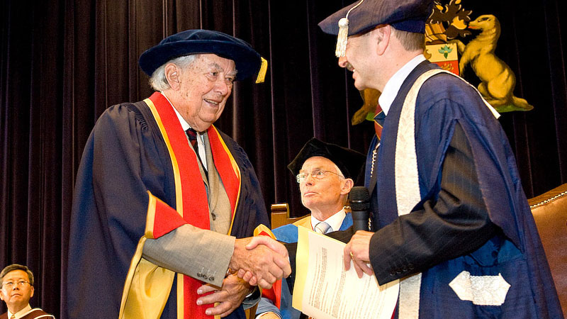 Roy Cairns receives an honorary degree from President Jack Lightstone, right, during Spring Convocation in 2009.