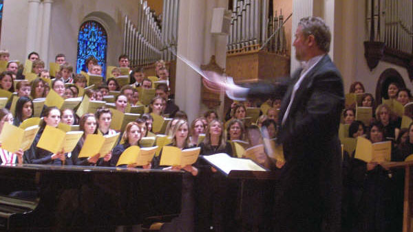 Harris Loewen conducts a Brock choir during a performance.