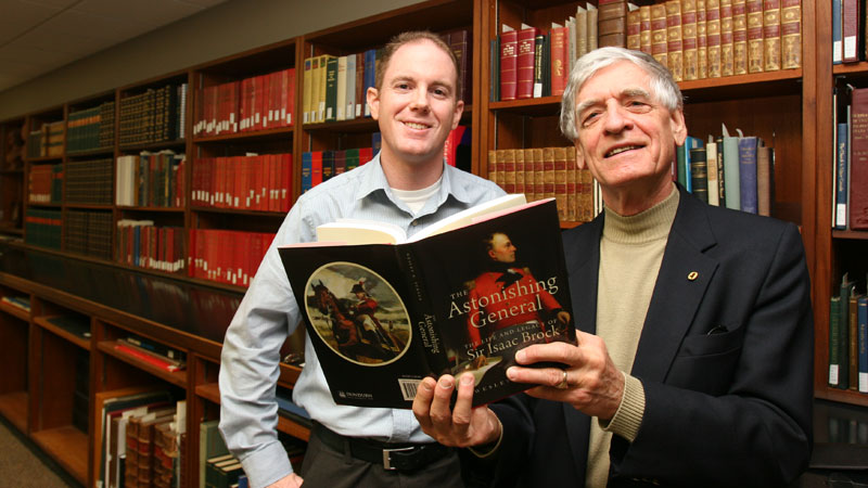 David Sharron, left, and Wesley Turner check out Astonishing General, Turner's new book about Sir Isaac Brock.