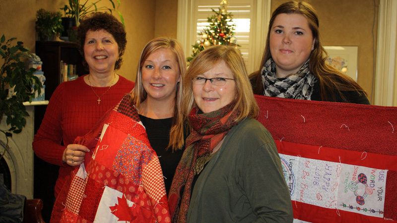 Two quilts from Brock's Volunteer Fest were donated to the YWCA this week. From left: Gloria Meyer from the Niagara Heritage Quilters Guild; Carli Taylor, administrative co-ordinator of the YWCA; Nicki Inch, fund developer, YWCA; Laura MacLean, student volunteer co-ordinator, Student Life and Community Experience