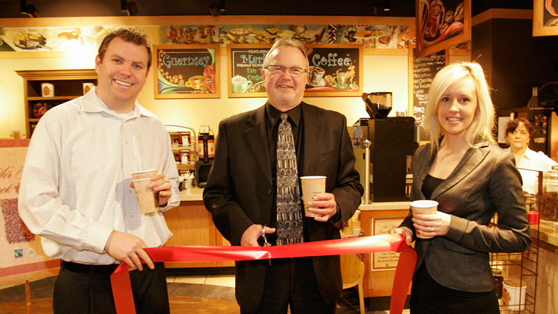 Jamie Burdon, Sodexo director of retail operations; Stephen Pillar, Vice-President Academic and Niki Vermeulen, marketing manager of the Guernsey Market, cut a ribbon for the new Sir Isaac Brock Blend.