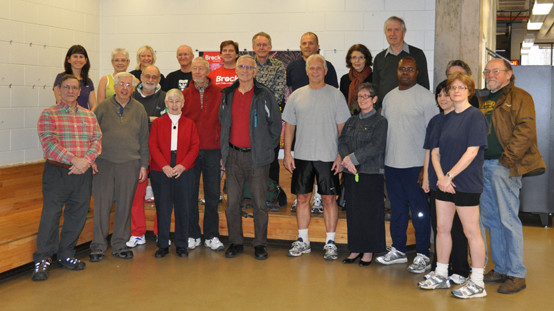 Original staff and faculty members of the Zone fitness centre pose for an anniversary photo.