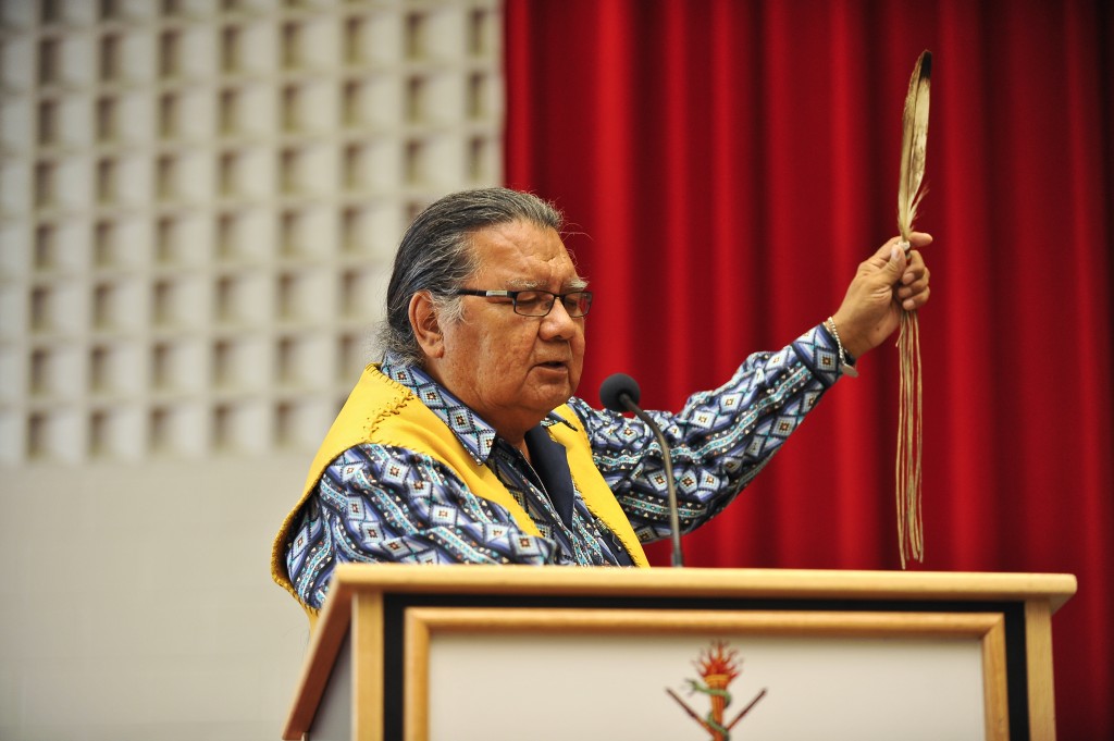 Elder Walter Cooke performs an invocation at convocation on Oct. 13.