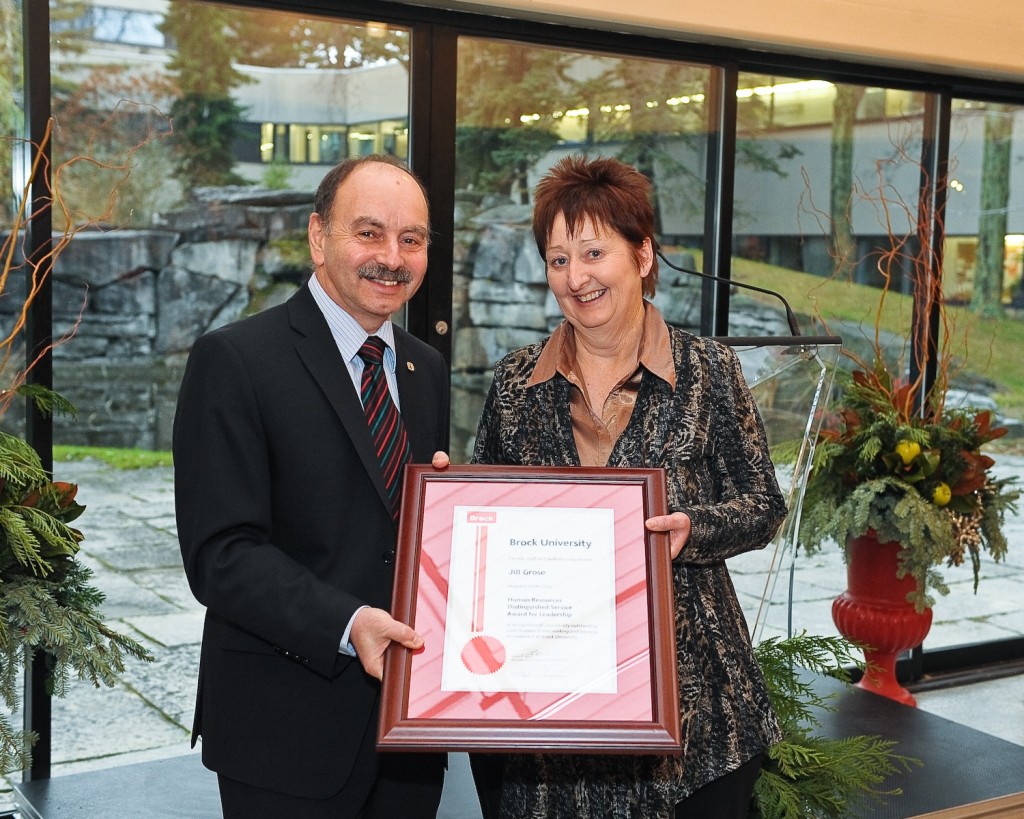 Jill Grose receives the Human Resources Distinguished Service Award for Leadership from Brock President Jack Lightstone. 