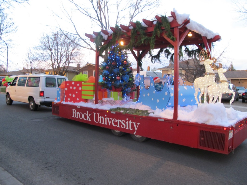 Volunteers are needed to hand out candy canes and walk alongside Brock's float at the Niagara-on-the-Lake Santa Claus parade Saturday. 