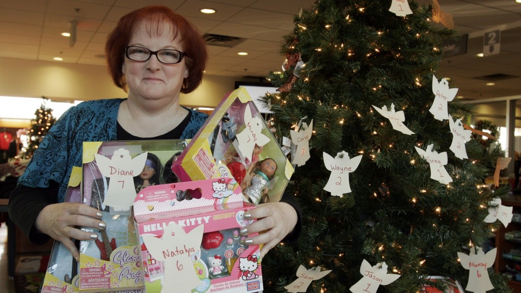 Tacy Atkinson from the Campus Store shows off some of the toys donated during this year's Adopt an Angel campaign. More than 550 toys were donated to the cause. 