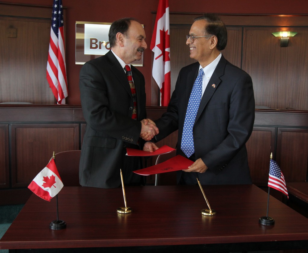 Brock President Jack Lightstone (left) and Satish Tripathi, President of the University at Buffalo, the State University of New York, renewed a five-year partnership agreement between Brock and UB Friday.