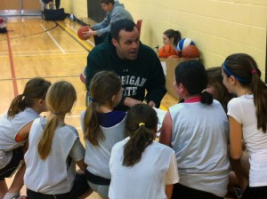 Prof. Philip Sullivan coaches a youth girls basketball team on weekends.