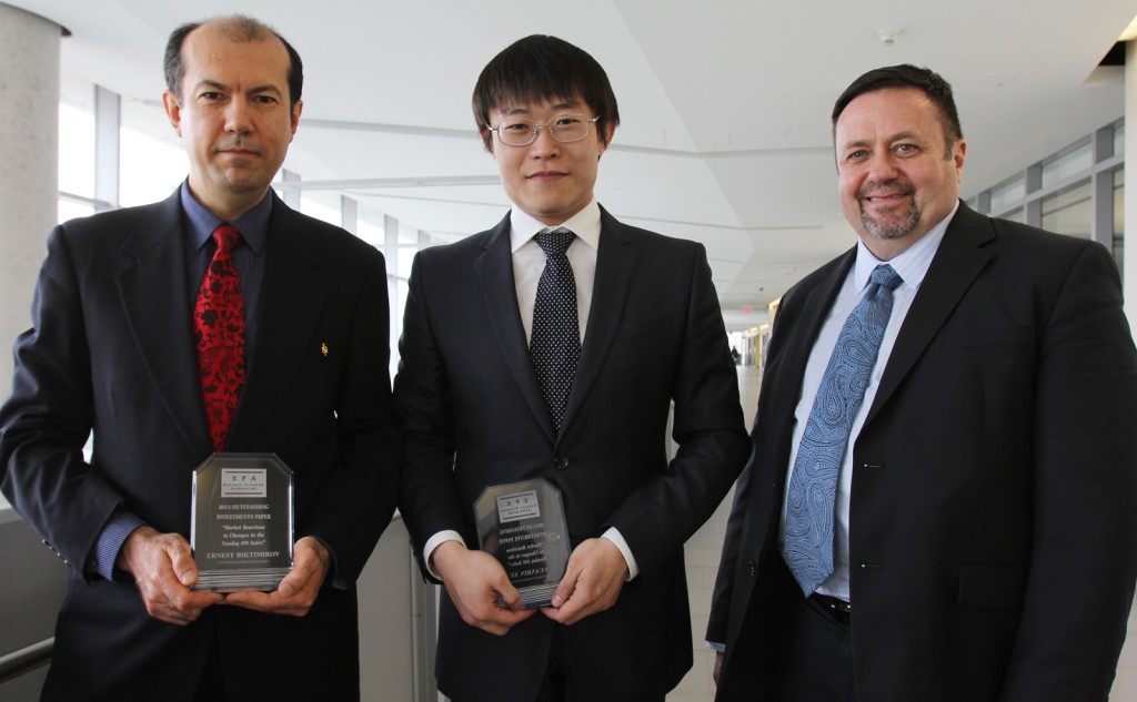 Ernest Biktimirov (right), associate professor of finance, and Yuanbin Xu, who recently completed his master's degree in finance, won an award from the Eastern Finance Association for a paper they co-authored. They are seen here with Don Cyr, Dean of Brock's Goodman School of Business. 