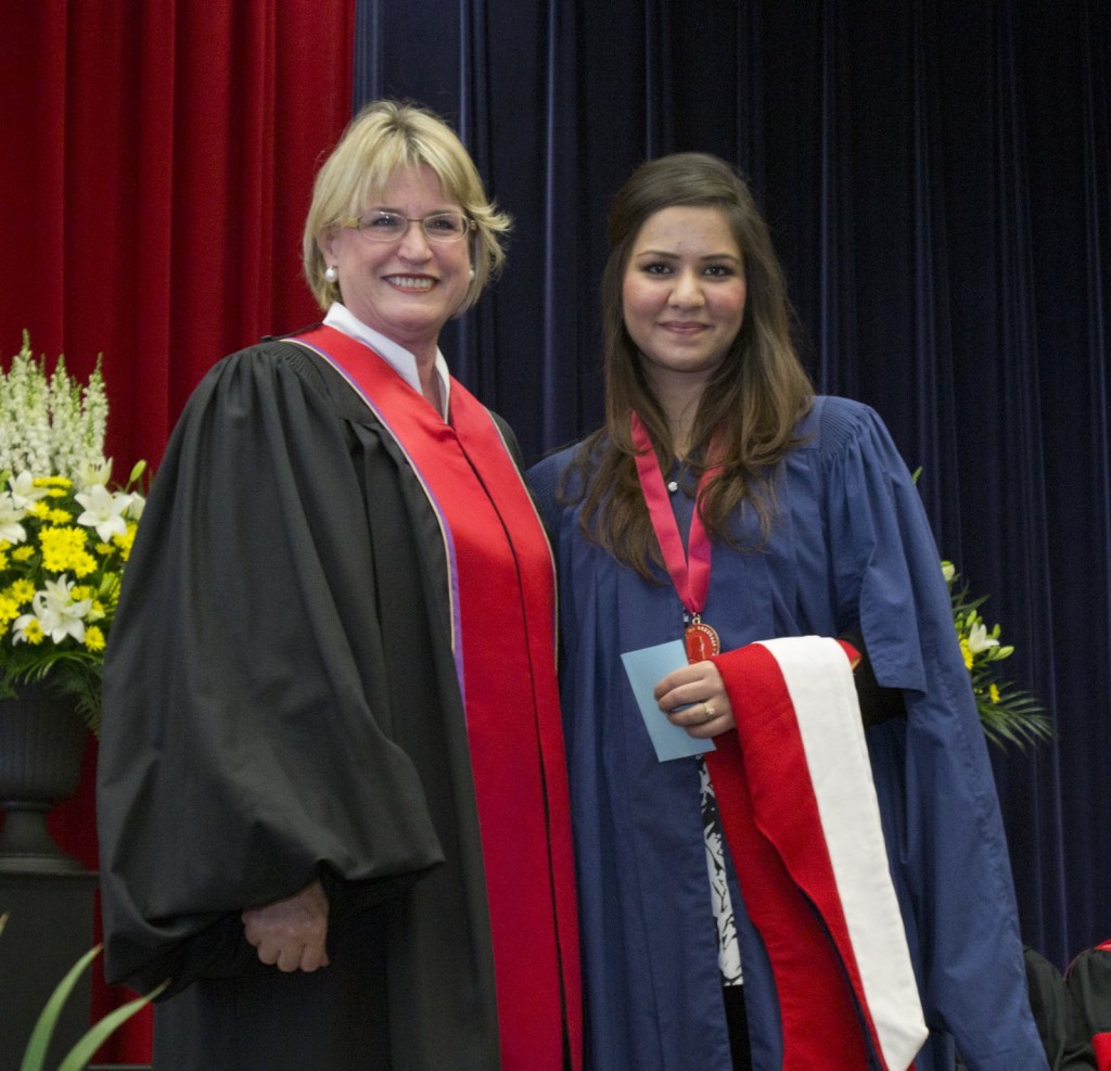 Trustee Helen Young (right) presented Binish Ahmed with the Spirit of Brock medal at Thursday morning's Faculty of Social Sciences convocation ceremony.