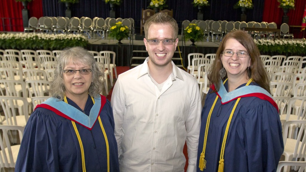 Mary Jane Bauer (left) and her daughter Lindsay graduated with their Bachelor of Education degrees Wednesday morning. Bauer's son Kelly (centre) graduates with his Bachelor of Science from Brock on Friday. 