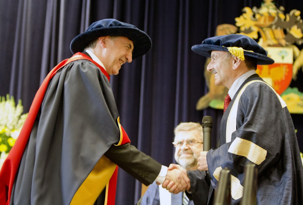 Neil Armstrong, professor of pediatric physiology, senior deputy vice-chancellor and vice-president  at the University of Exeter, receives his honorary degree from Brock President Jack Lightstone.