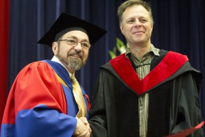 Joffre Mercier (left), Associate Vice-President of Research, presented Michael Bidochka, a biological sicences professor, with Joffre Mercier (left), Associate Vice-President of Research, presents Prof. Michael Bidochka in the Department of Biological Sciences, with the award for distinguished research and creative activity.