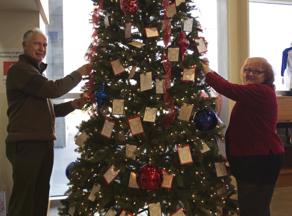 Dan Lewis, Campus Store director, and Tacey Atkinson, Campus Store sales and service co-ordinator, have decorated a Christmas tree with 500 local children's identities for the annual Adopt an Angel campaign. The campaign is a toy drive done in partnership with Community Care of St. Catharines and Thorold to ensure children in need have a gift to open during the holidays. 