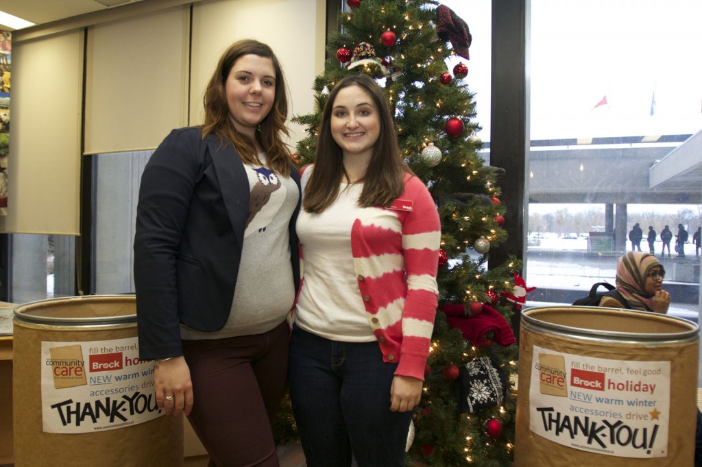 Students Lauren Tucker and Allison Whitworth are helping with the annual Giving Tree campaign, which collects warm winter woolens and coats for Community Care of St. Catharines and Thorold.