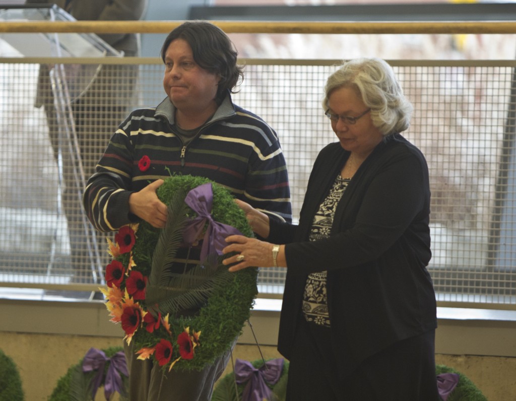 Sean Hoogterp, student advisor in Aboroginal Student Services, and Carol Jacob, cultural advisor, lay a wreath Monday during Brock's Remembrance Day ceremony.