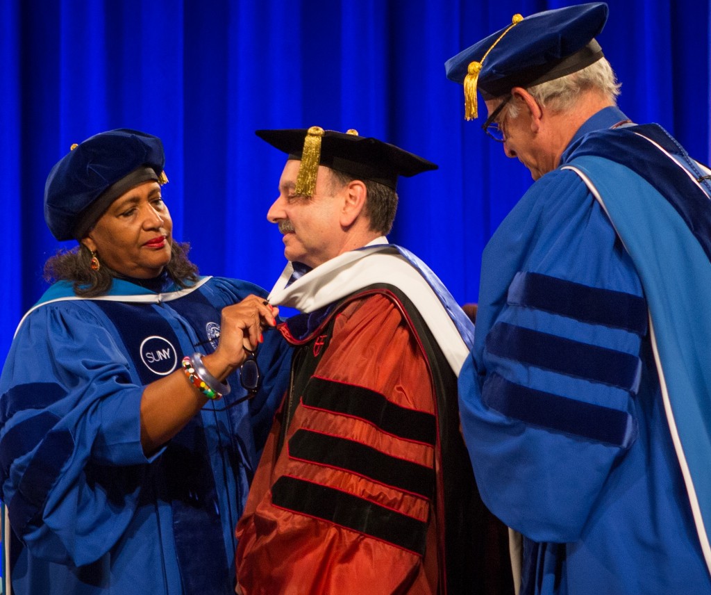President Lightstone is hooded at the University at Buffalo’s May 18 commencement ceremony where he was presented with a Honoray Degree of Humane Letters. 
