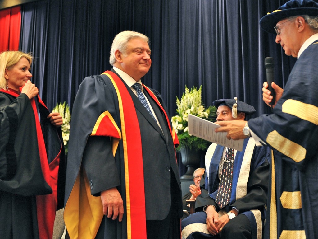 In June 2012, Greenspan receives his honorary doctorate from University Chancellor Ned Goodman. 