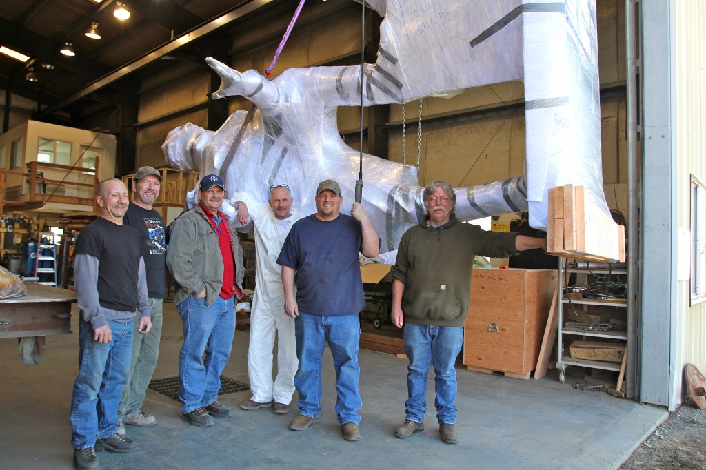 Some of the Valley Bronze staff, with a wrapped and suspended General Brock, get ready for the loading.  