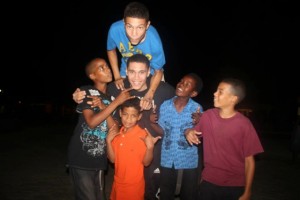 Marcus Bernard (centre) with children in the Dominican Republic.