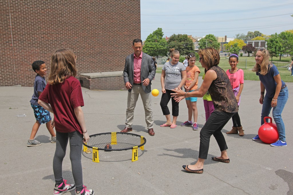 Nancy Cameron (right) and Dave DiFelice (cnetre) from Canadian Tire Jumpstart play spike ball with students at Prince of Wales School in Thorold Monday. Canadian Tire Jumpstart has contributed $230,000 to the Recess Project, which aims to make the school day breaks more fun and inclusive for students at the school. 