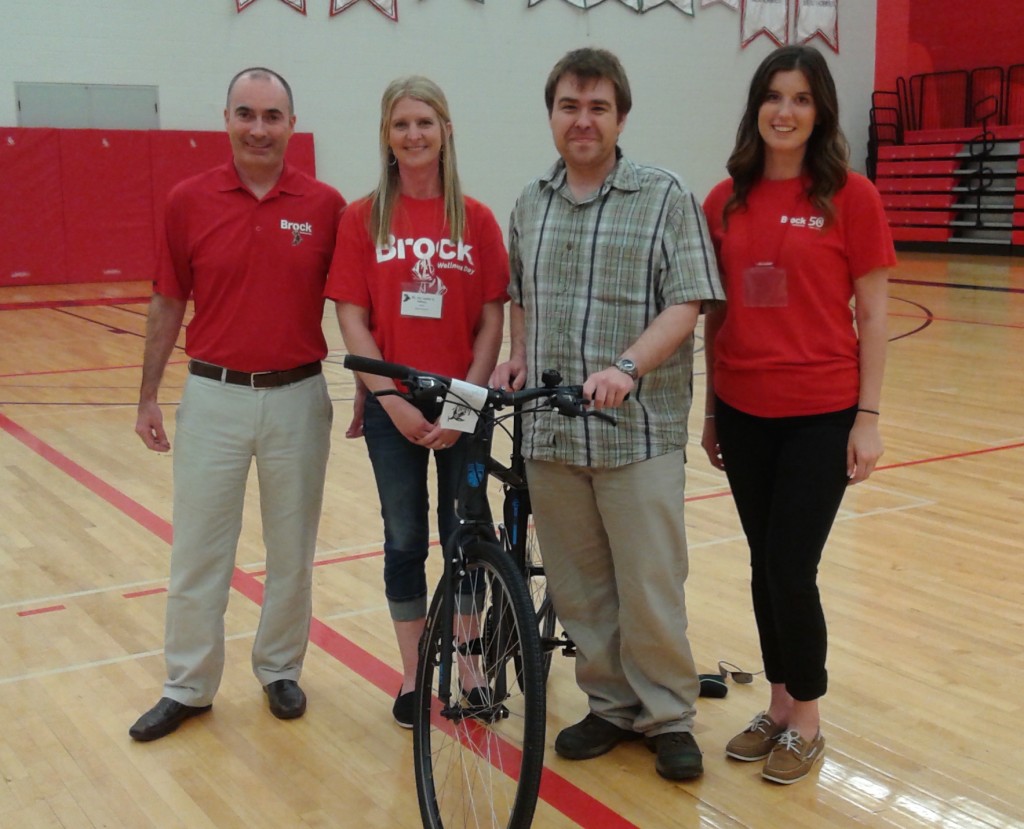 Jonathon Therrien (second from right) was the winner of the bike, donated by Greenshield, on Wellness. With him are (from left) Darren Harper, 