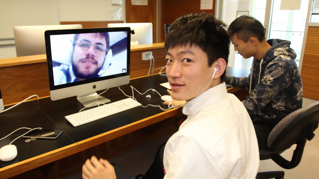 Brock student Tanghui (Eddie) Liu practises his English with a student at a university in Brazil using a program called Teletandem that allows the students to converse face to face. 