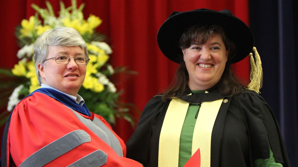 Interim Humanities Dean Carol Merriam presents Prof. Renée Lafferty-Salhany with the Faculty Award for Excellence in Teaching at Saturdays convocation ceremony for the Faculty of Humanities. 