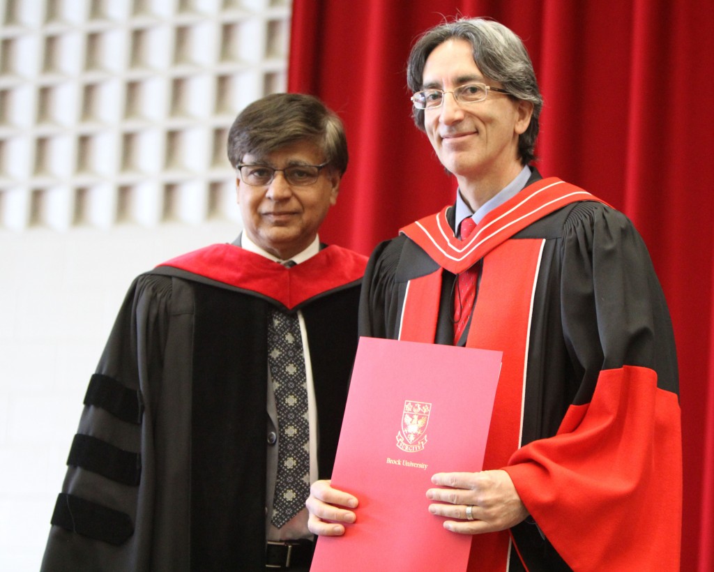 Department of Physics Assistant Professor Santo D’Agostino (right) was presented the Faculty of Mathematics and Science by Dean Ejaz Ahmed.