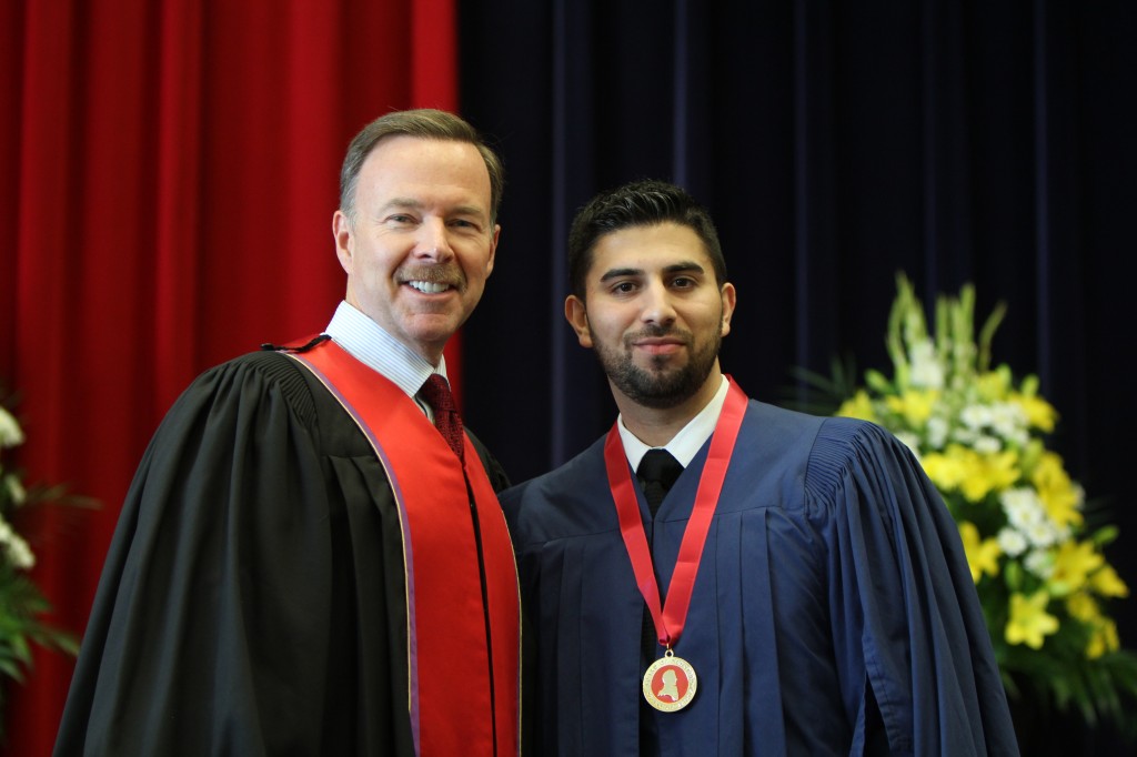 Jason Ribeiro, who graduated with his Master of Education, received the Spirit of Brock medal from Joe Robertson of Brock's Board of Trustees Wednesday afternoon.