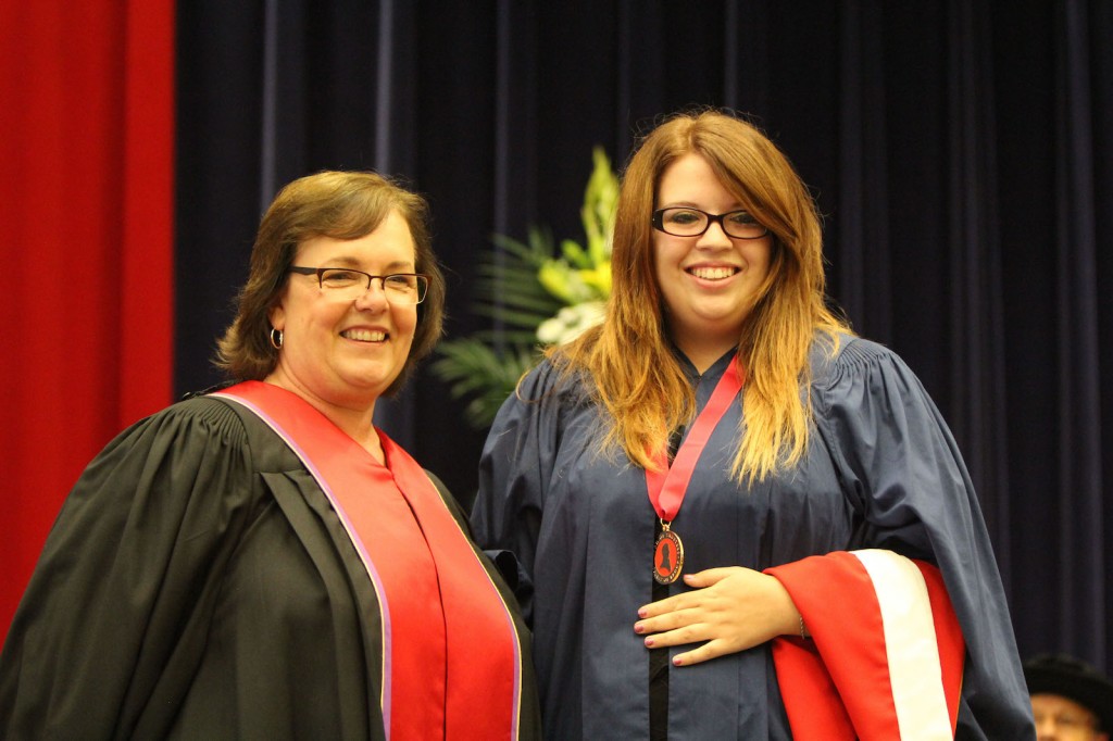 Kaitlin McKay (right) was presented the Spirit of Brock medal Tuesday by Kristine Freudenthaler of Brock's Board of Trustees.
