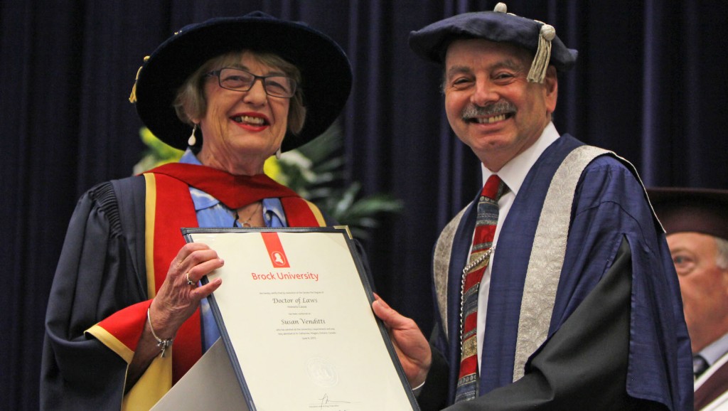 Susan Venditti, executive director of Start Me Up Niagara, receives an honorary degree from Brock President Jack Lightstone at Tuesday's Social Sciences convocation ceremony.