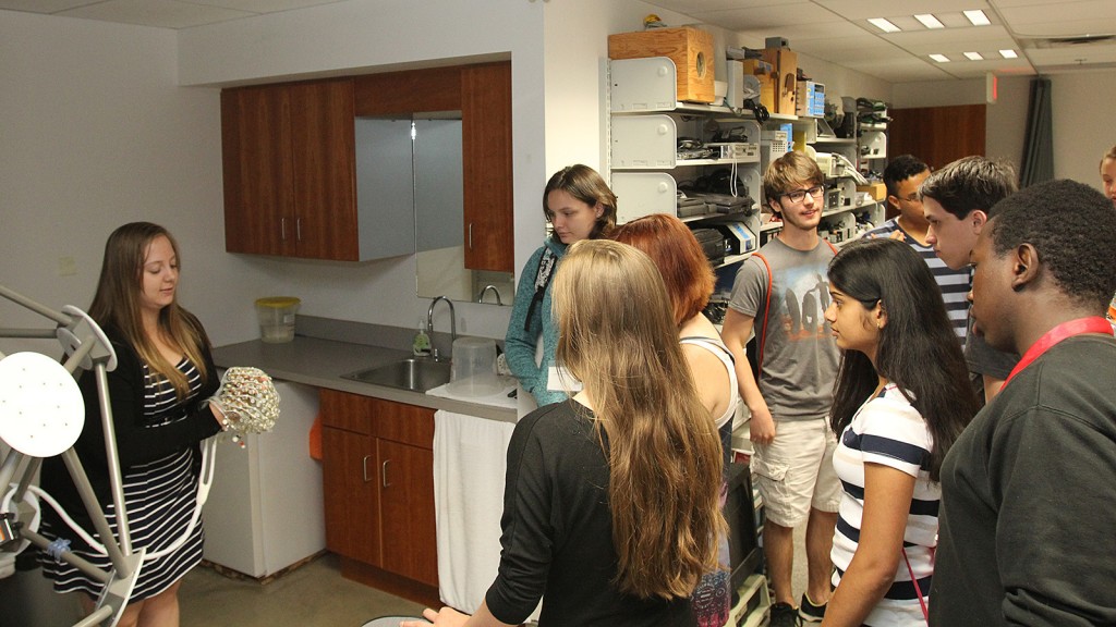 A group of Niagara high school students listens to Centre for Lifespan Development Research coordinator Ashley Rail give a demonstration in one of the labs Thursday morning.