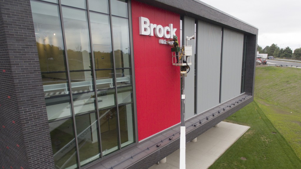 Sebastian Duivenvoorden, from Cesco Signs and Lighting, installs the Brock University lettering on the Marilyn I. Walker School of Fine and Performing Arts in downtown St. Catharines Thursday morning. Brock's downtown campus is set to open next month.