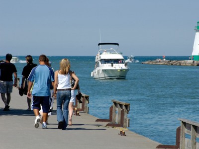 People walking along the Port Dalhousie boardwalk on Lake Ontario