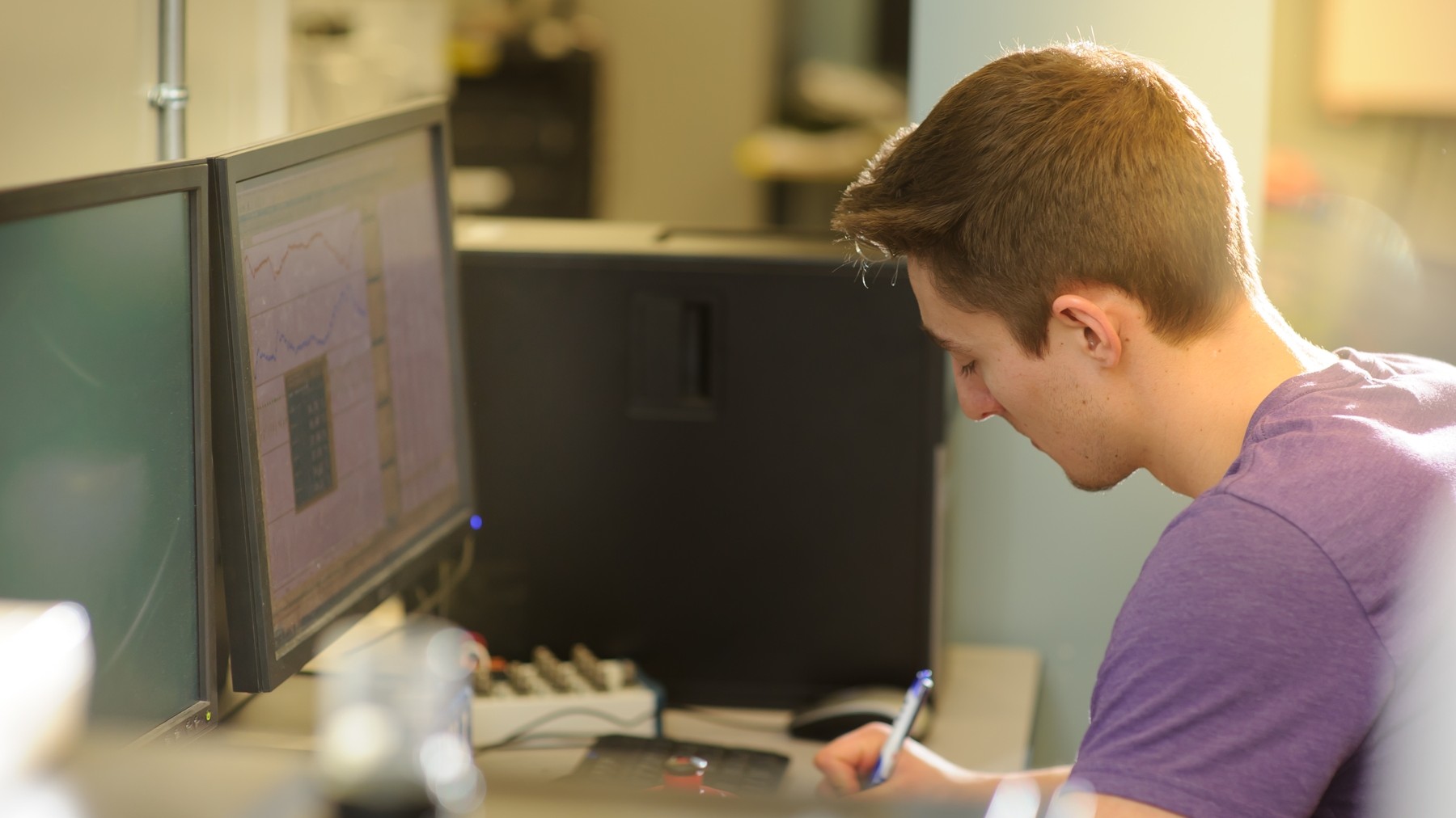 Male student working at a computer
