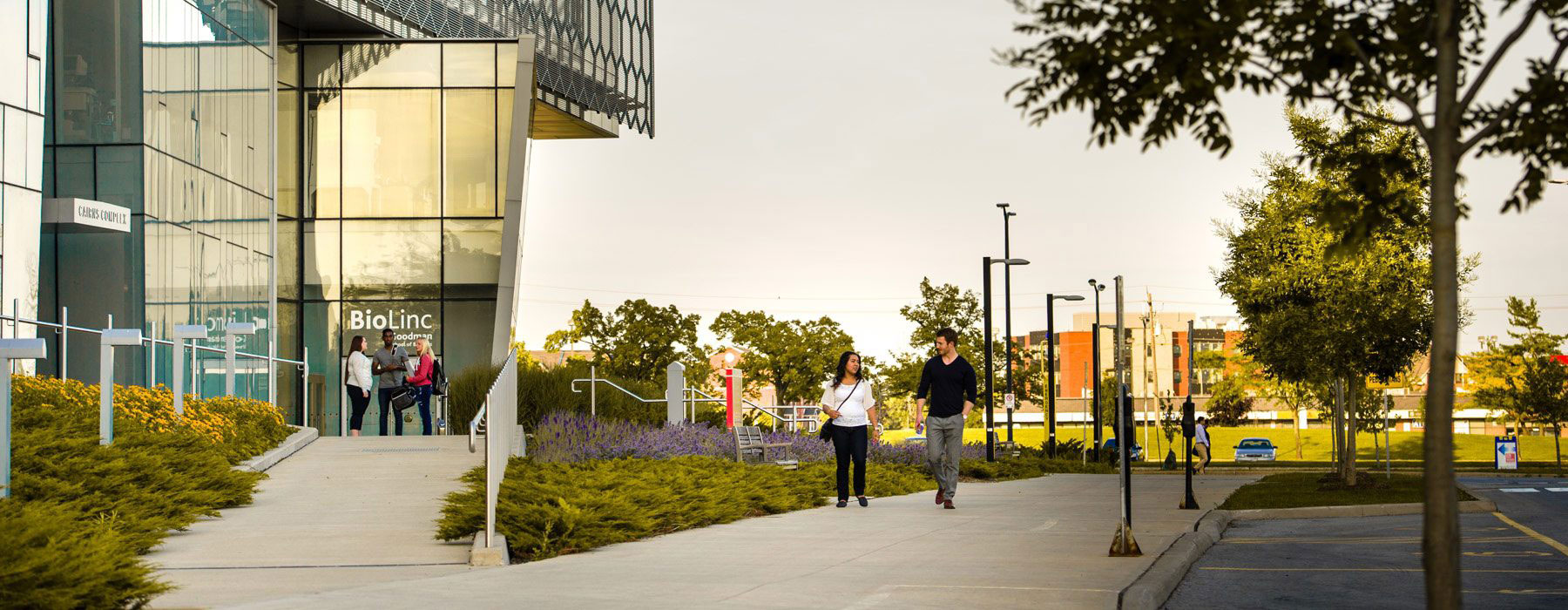 Two students walking through Brock Campus