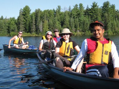 Two groups of students in canoes.