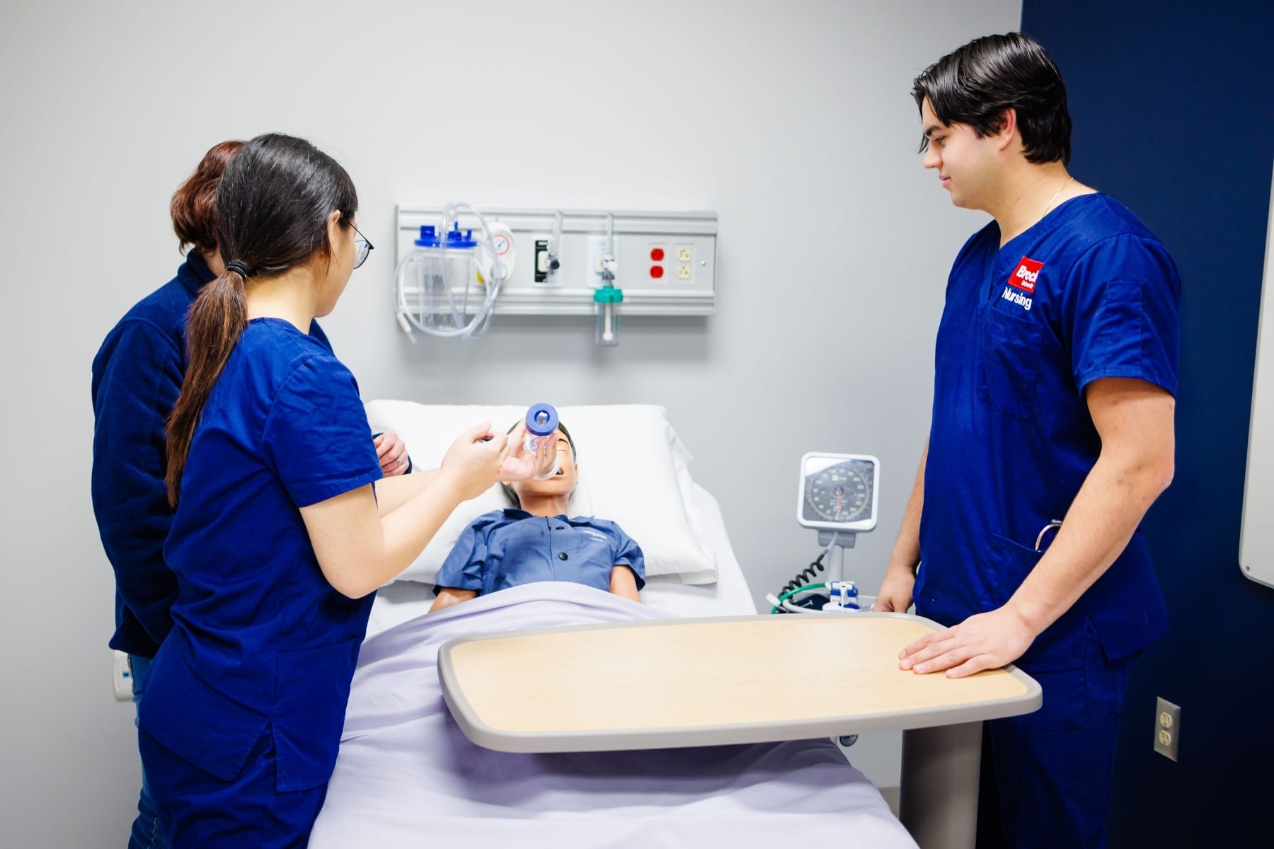 Nursing students working in the simulation lab