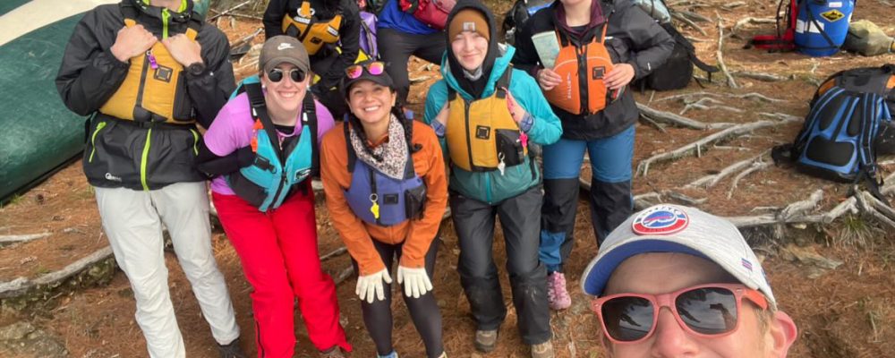 Group of students on campsite wearing PDF's