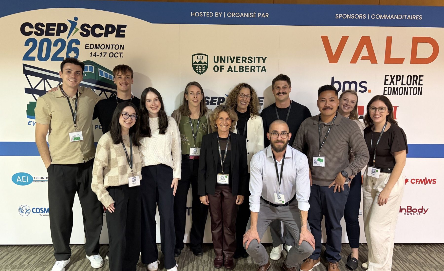 FAHS researchers with grad students at conference 