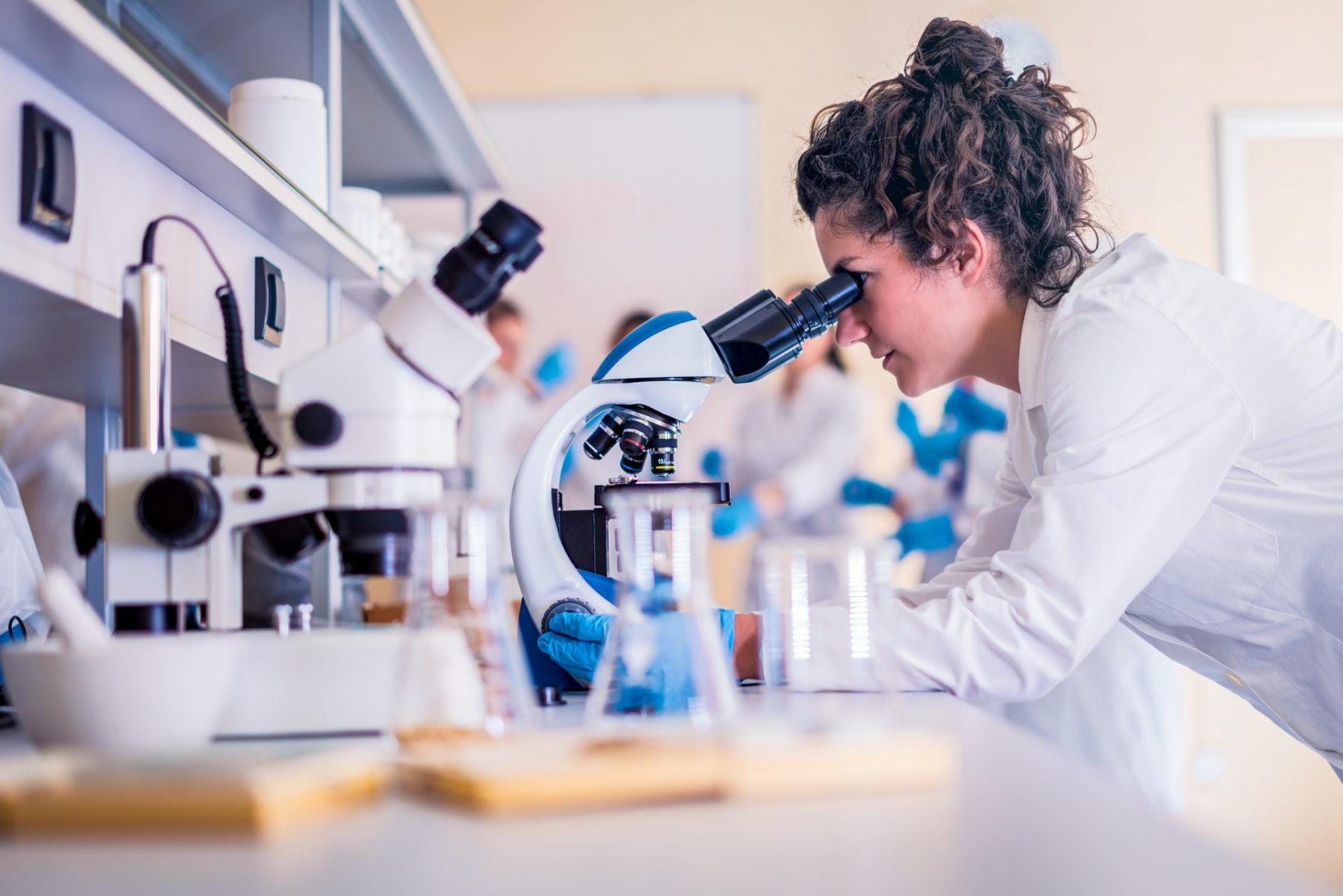 Student using microscope in lab