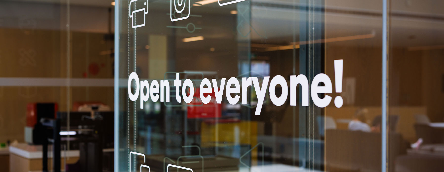Photo of wall in RFP building that says "open to everyone"