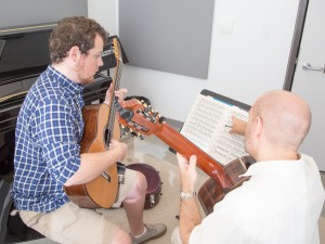 A guitarist works with an instructor in one of the music studios in the MIWSFPA.