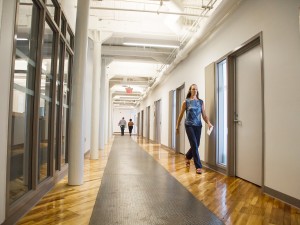 Aspects of the 19th century architecture from the Canada Hair Cloth building were incorporated into the MIWSFPA new design. Including this hallway with original wood and steel.